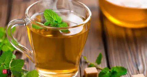 Cup of herbal tea with mint showing daily health benefits for men